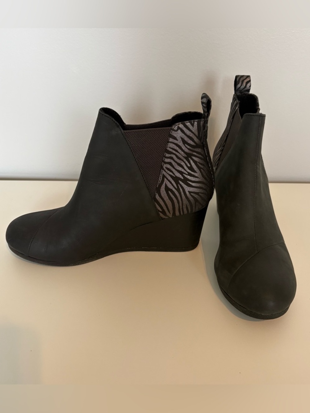 Tom’s Women’s Kelsey Black Leather Wedge Ankle Boots in Black with Zebra Accent